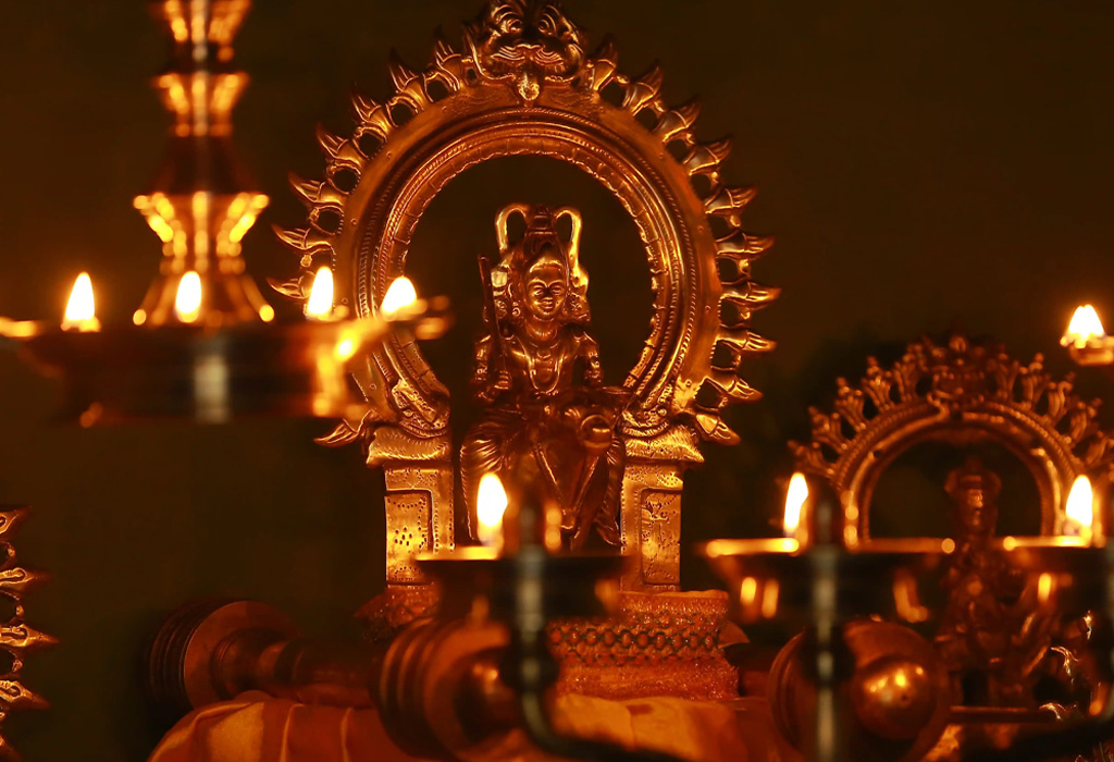 Devotees praying to Kuttichathan at a traditional Kerala temple